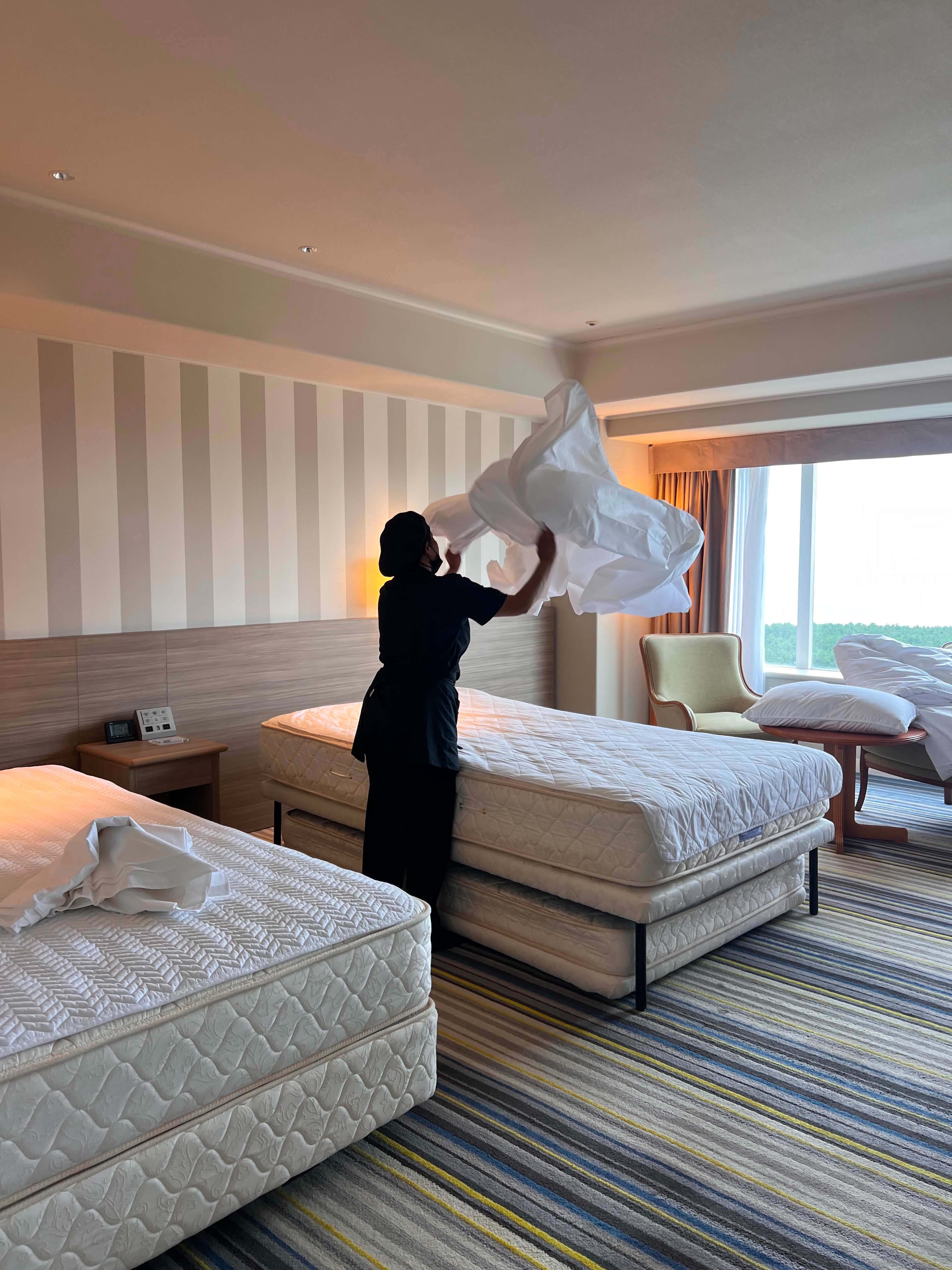 Staff making bed